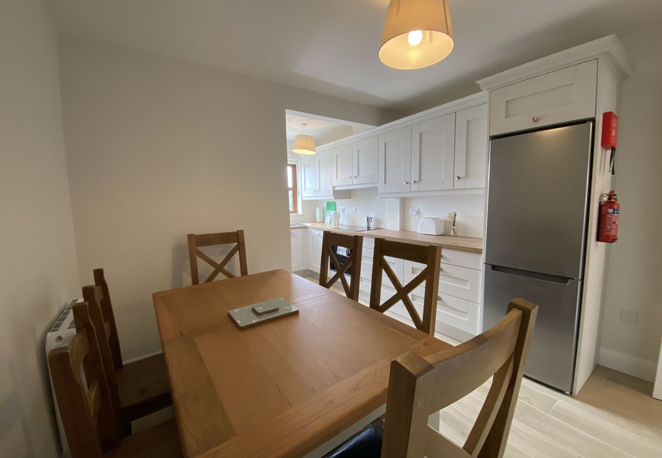 Clifden Town Holiday Apartment. Open plan combined kitchen and dining area seats 6.