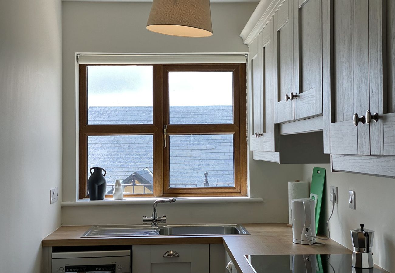 Clifden Town Holiday Apartment. Fully equipped kitchen with window.