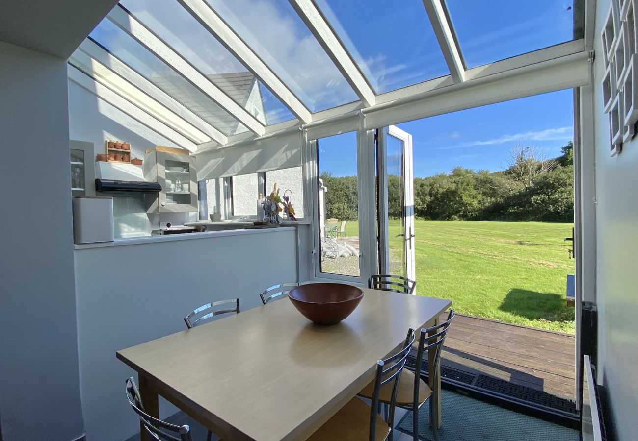 Clifden Glen Holiday Village No 58. Dining area, views to garden, conservatory seating for 6.