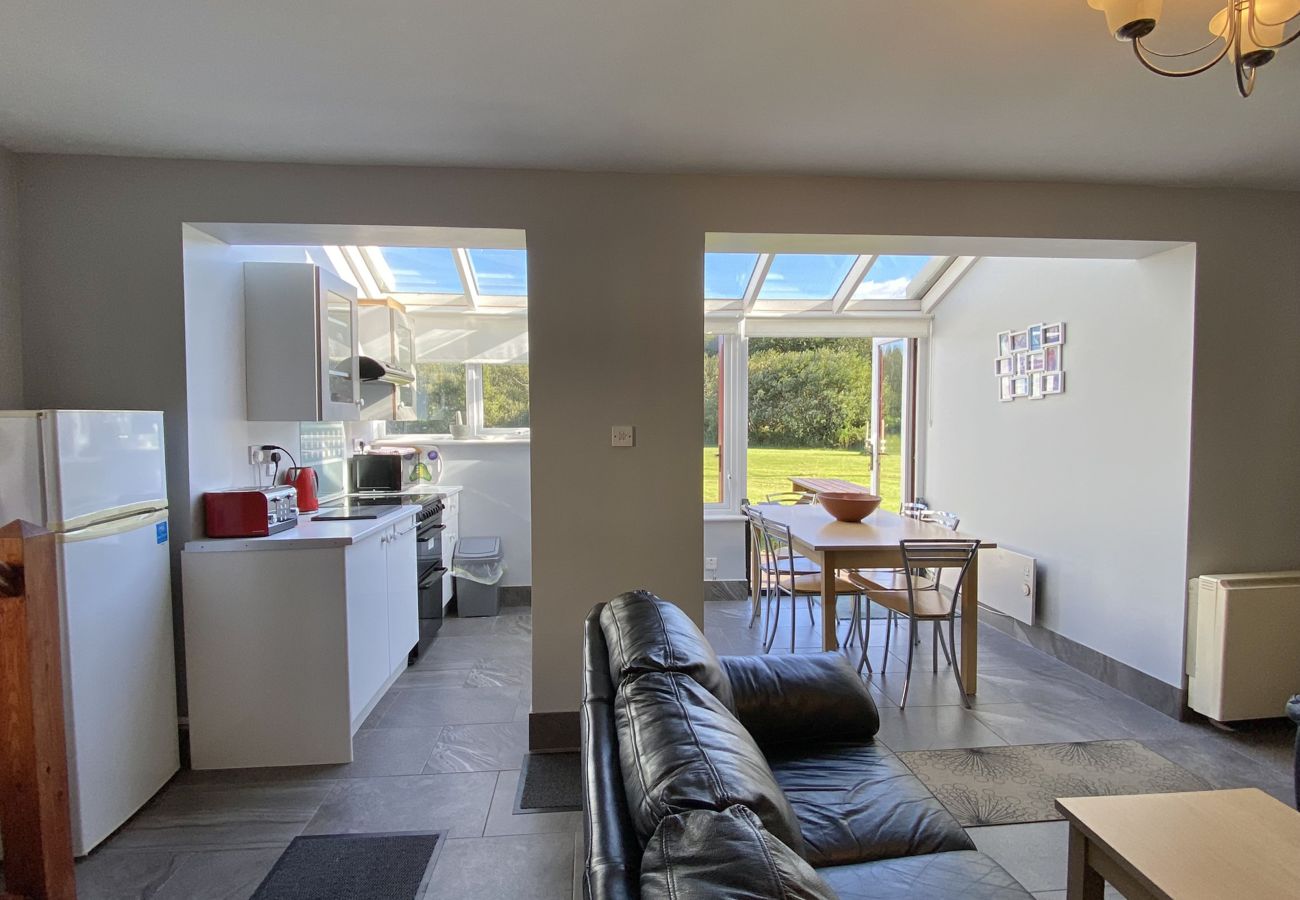 Clifden Glen Holiday Village No 58. Open plan dining, kitchen, and living room. Views to garden. 