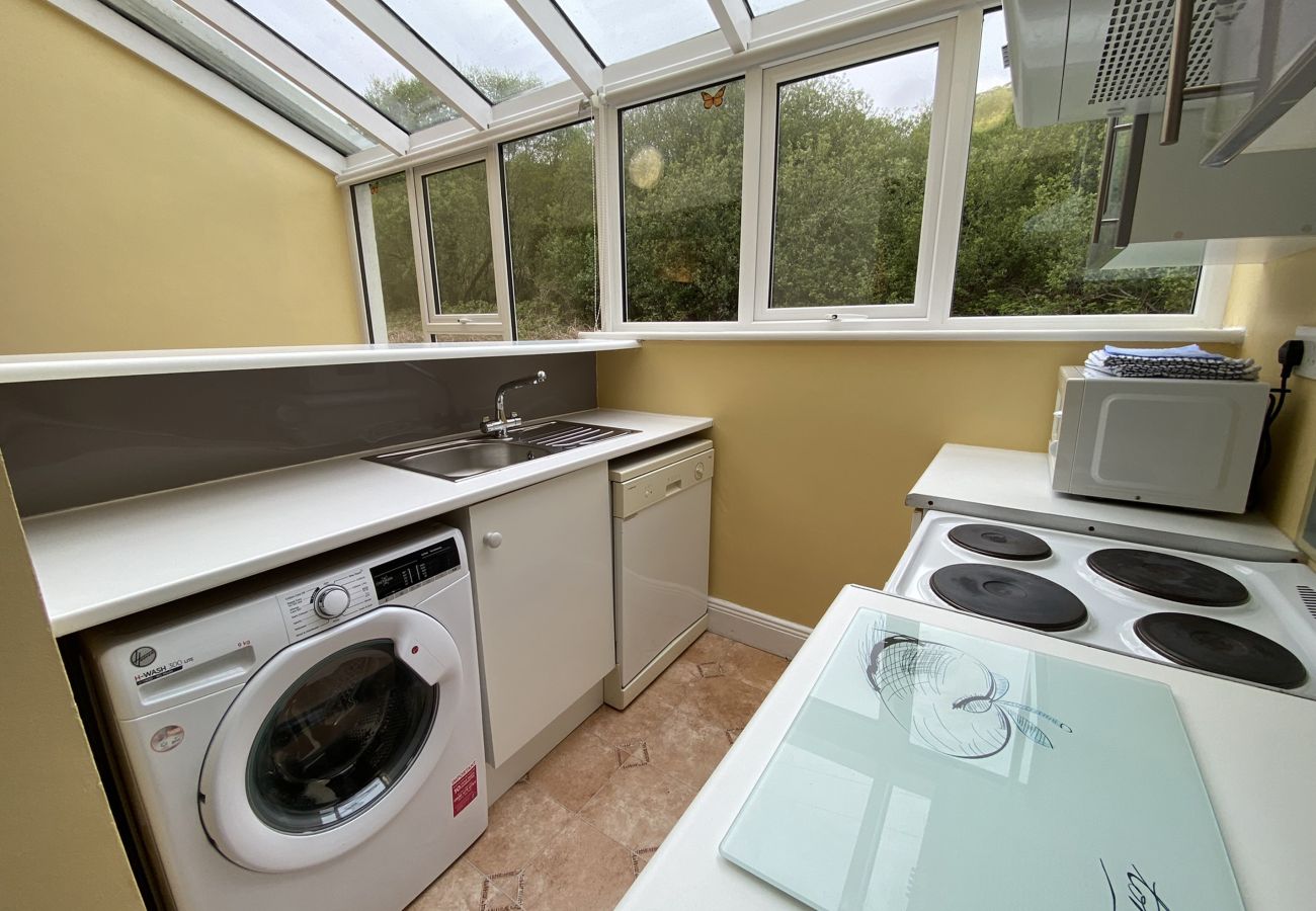 Clifden Glen Holiday Village No 11. Clifden Co Galway.  Compact Kitchen with all appliances. View to garden.