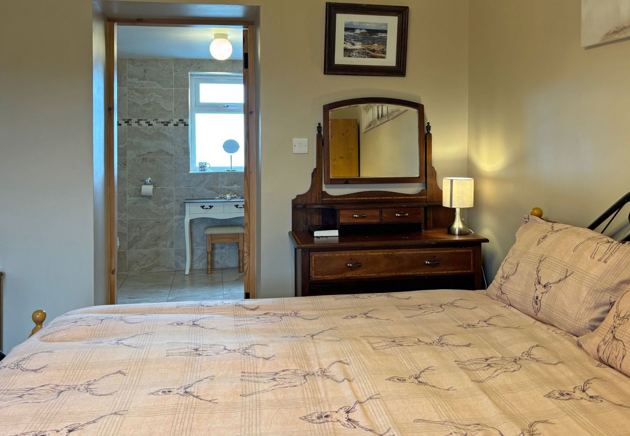 Conroy's Cottage Carna. Traditional double room Wardrobe and dressing table. En suite bathroom. 