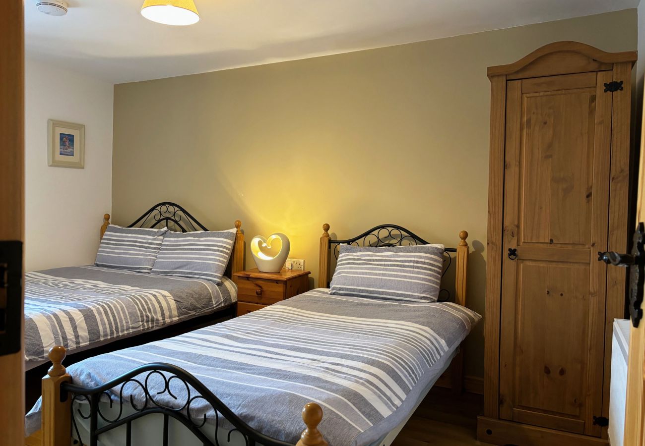 Conroy's Cottage Carna. Double bed and single bed. Cosy room with views. Pine wardrobe.