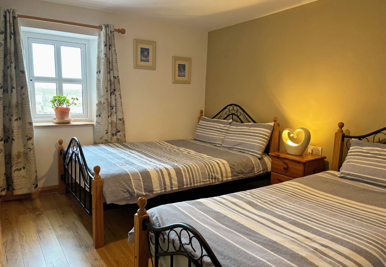 Conroy's Cottage Carna. Double bed and single bed. Cosy room with views. 