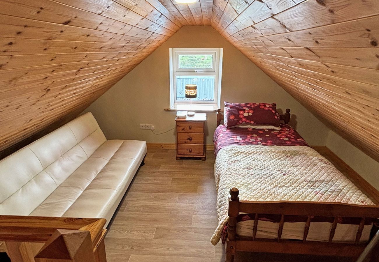 Conroy's Cottage Carna. Mezzanine. Single bed and sofa bed with views. 